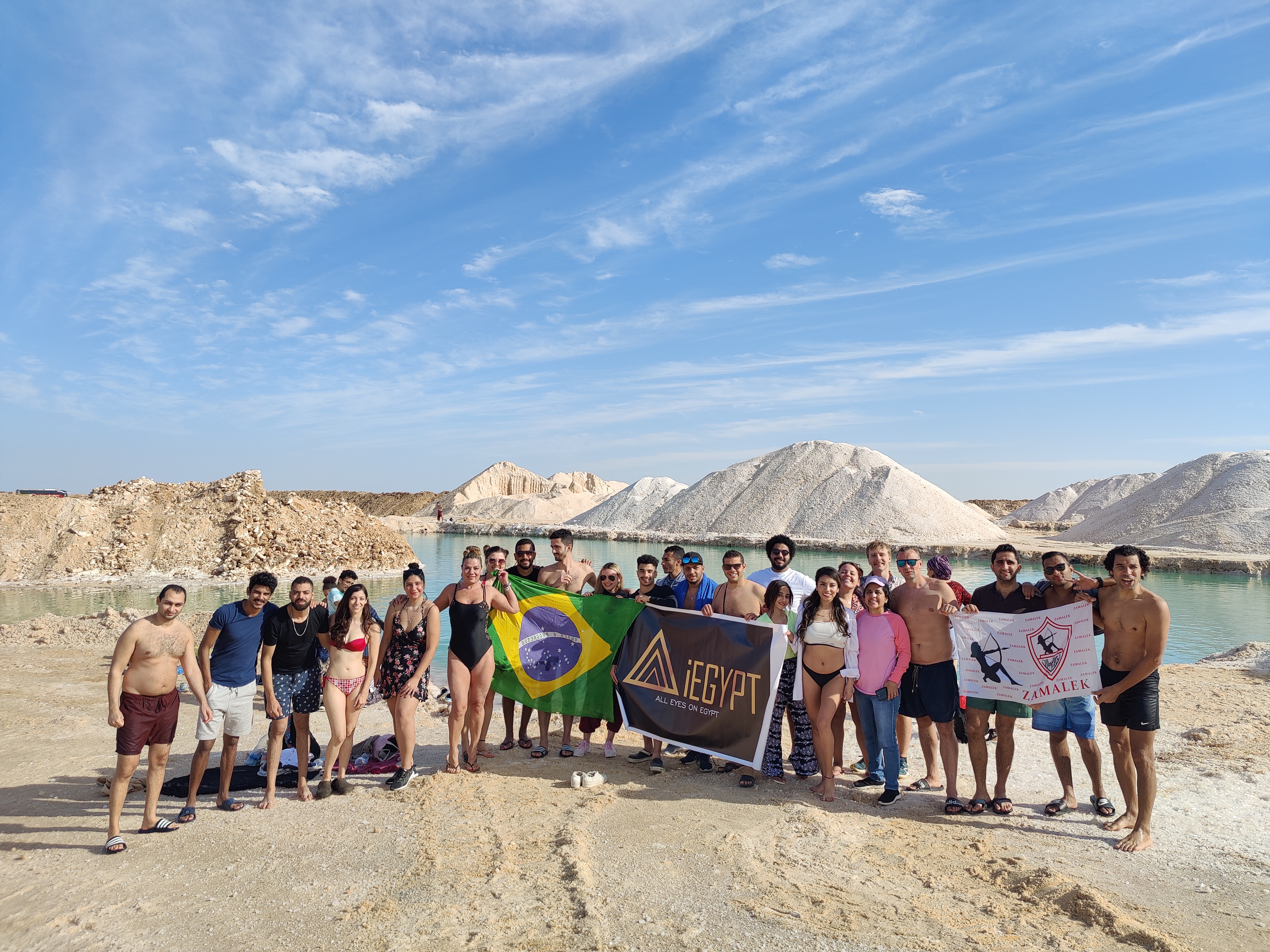 Travelers visiting and enjoying siwa springs with i Egypt Travels Guide and team