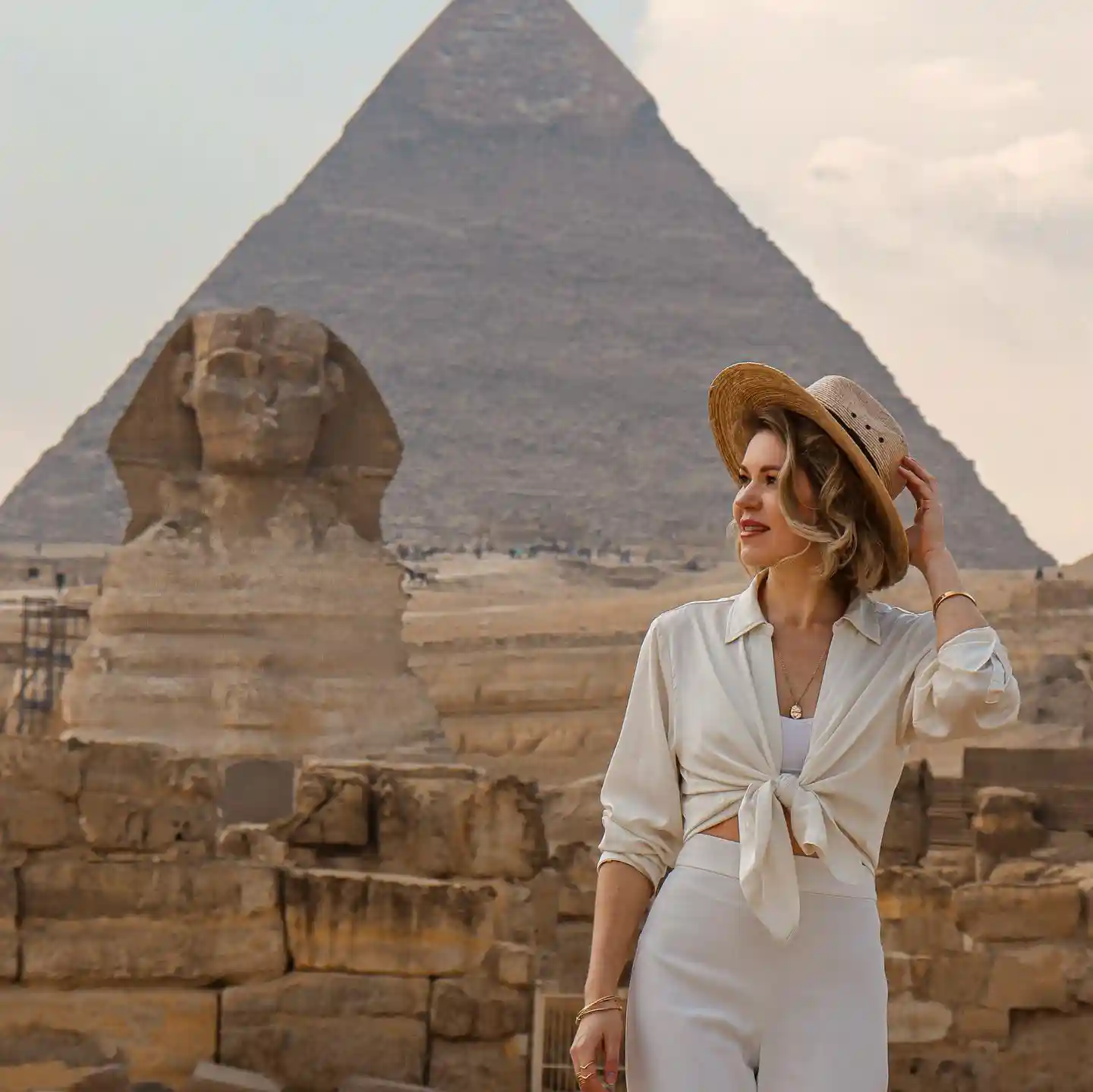 Beatiful blogger visiting the pyramids of Giza with iEgypt tours and travels
