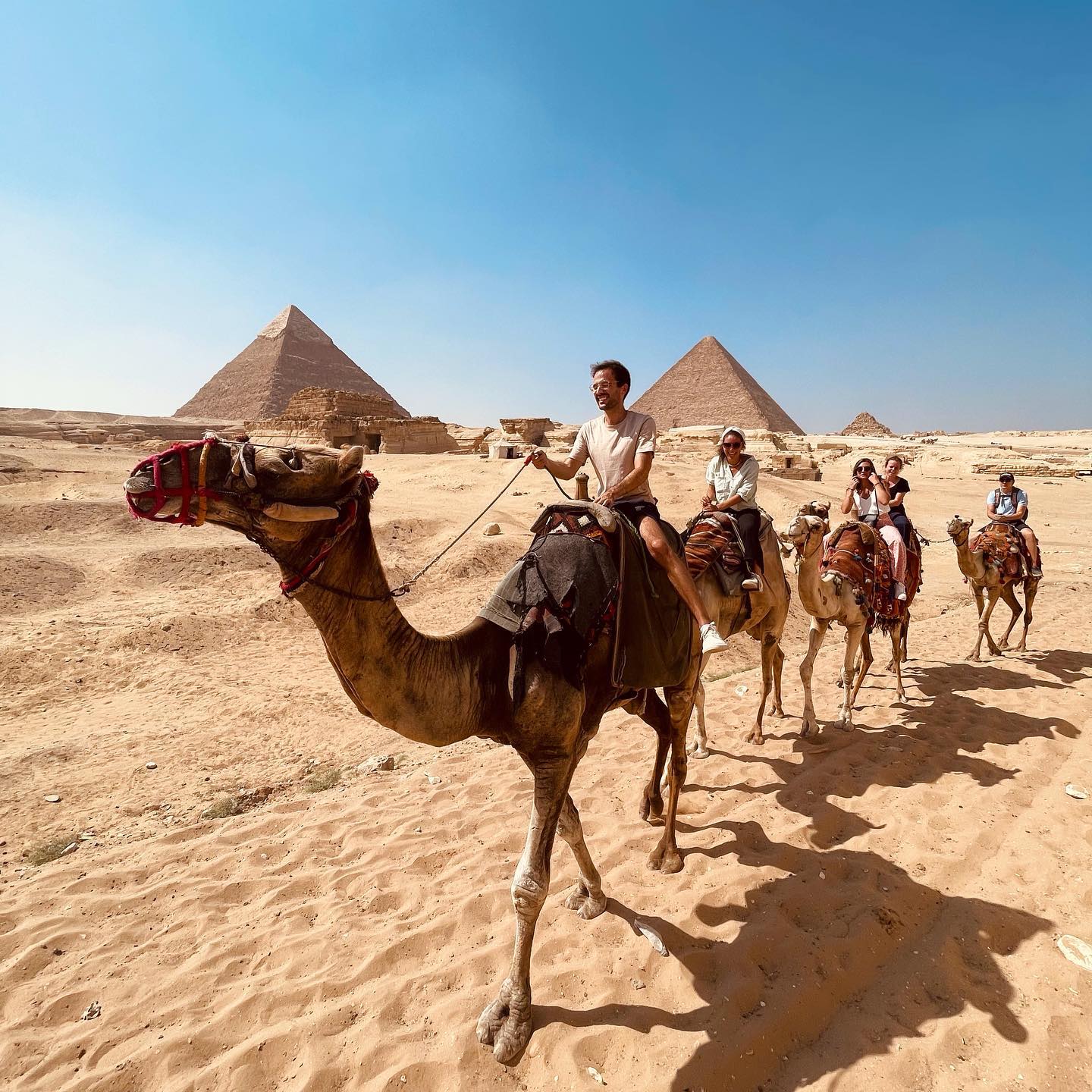 Riding camels at the pyramids of Giza with iEgypt Travels tour