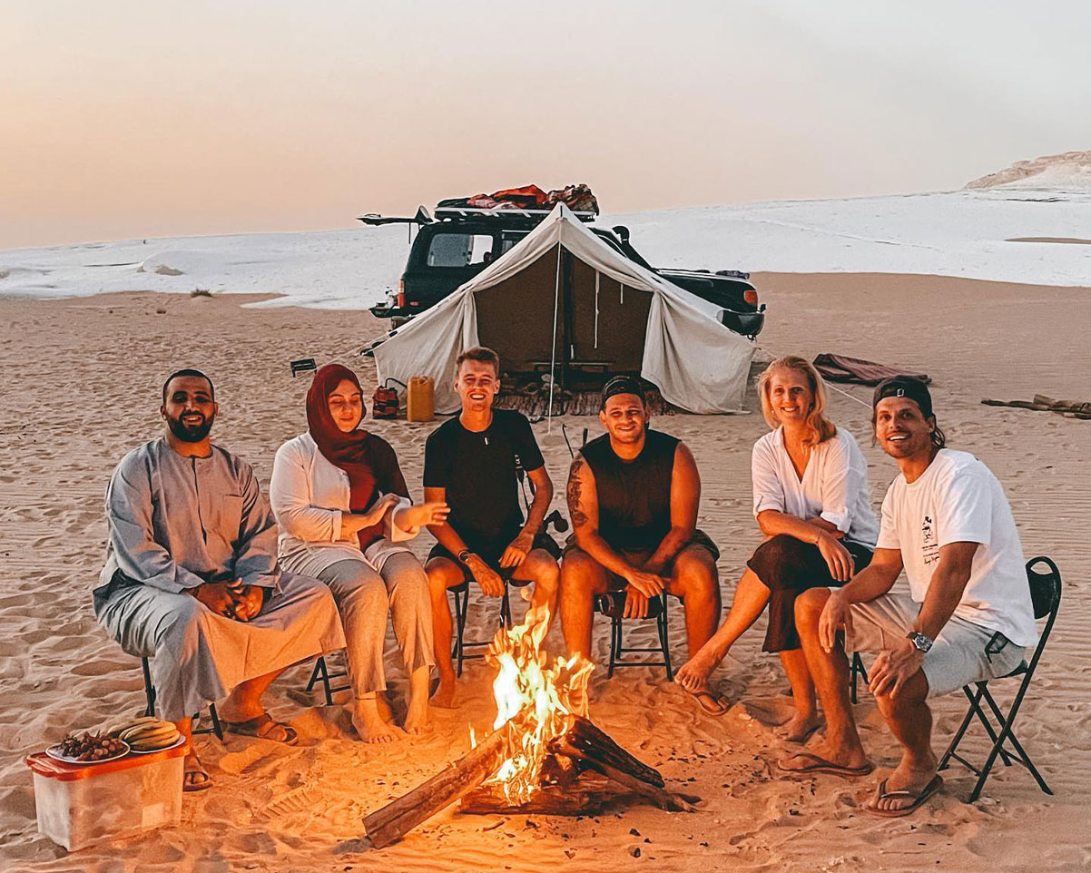 A group of 5 bloggers and travelers enjoy their camping at the white desert with Joe samy