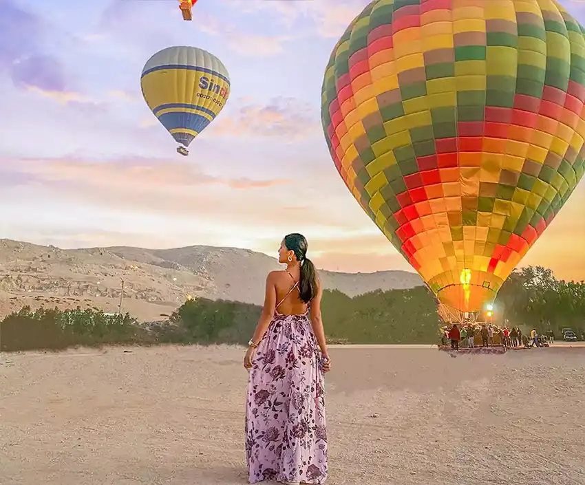 Hot air balloon and woman wearing dress