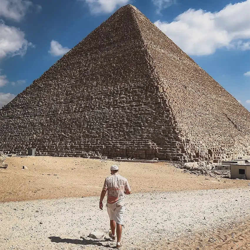 1foot_4ward at the pyramids man wearing shirt and short at the pyramids