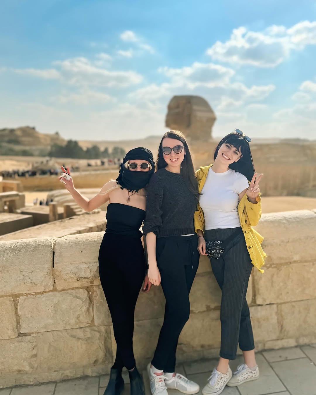 Three friends posing in front of the Great Sphinx at Giza