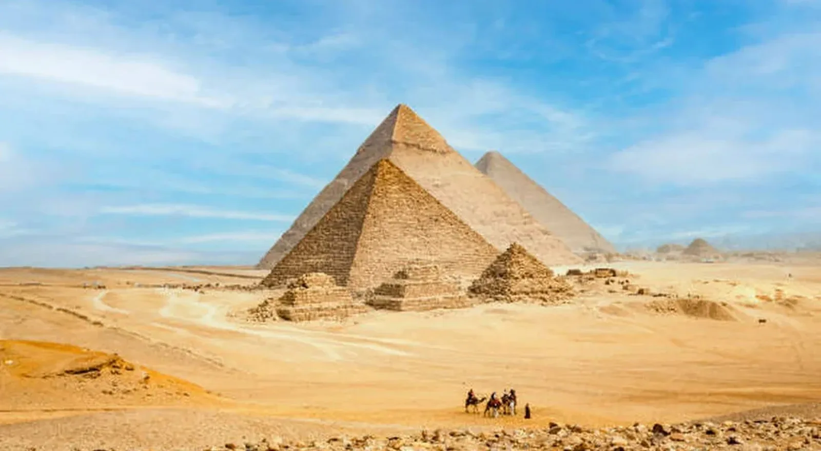 The Giza pyramids with a camel caravan in the foreground