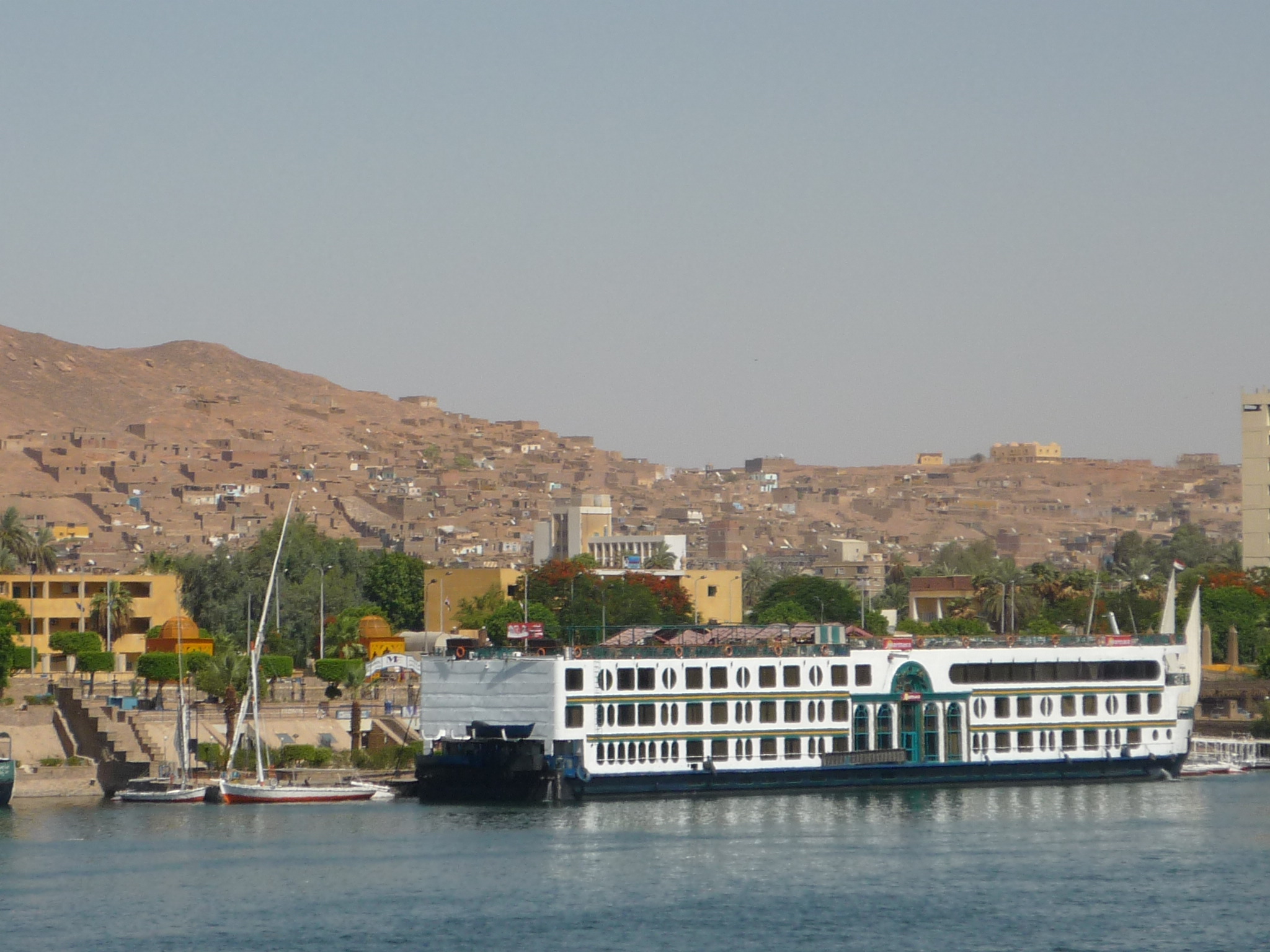 A Nile cruise ship moored on the riverbank at Aswan