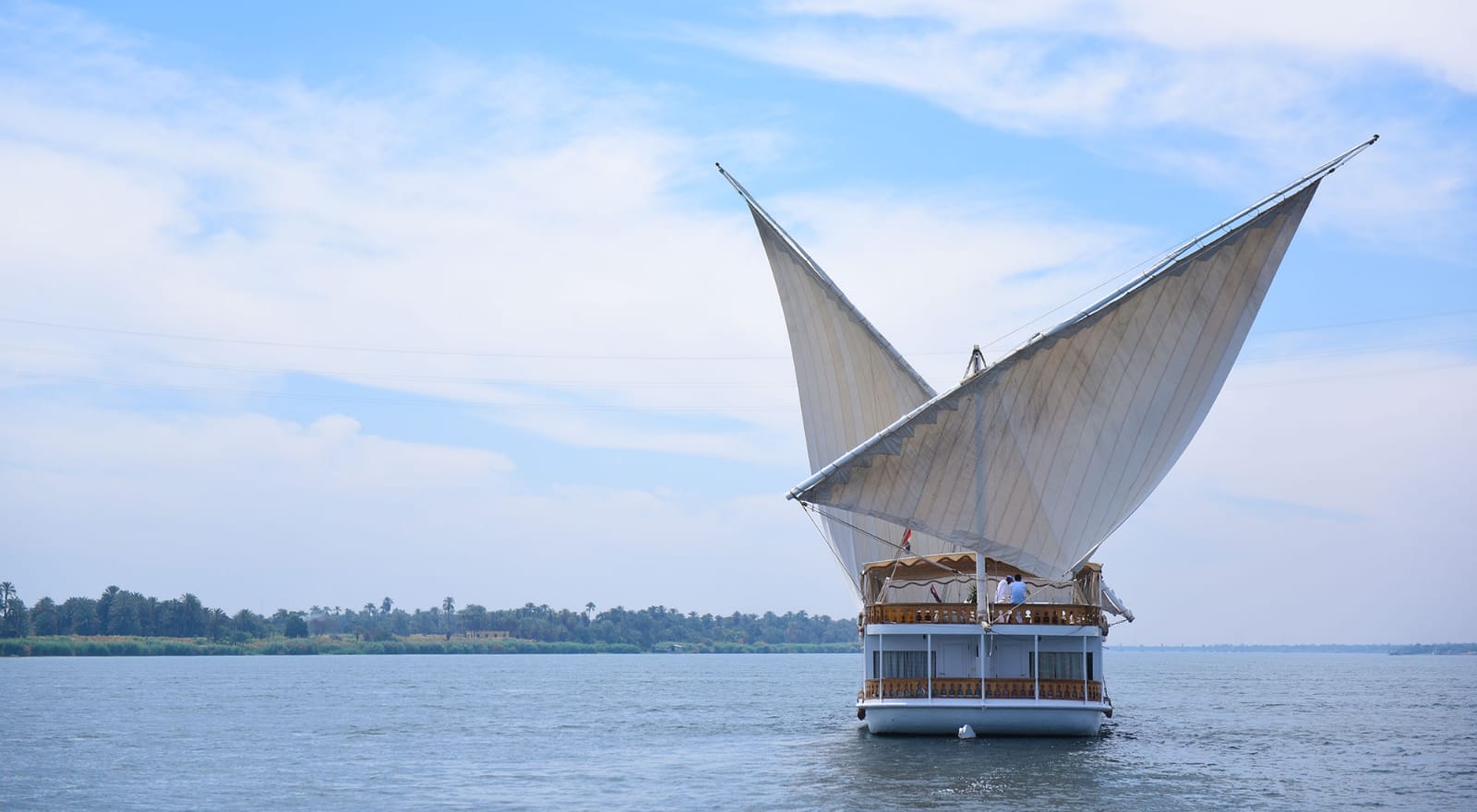 A traditional dahabiya with twin sails on the Nile in southern Egypt