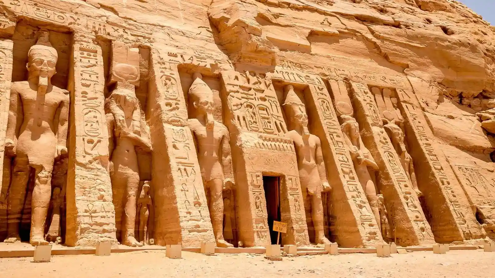 The carved rock facade and standing statues of the Temple of Nefertari at Abu Simbel in southern Egypt