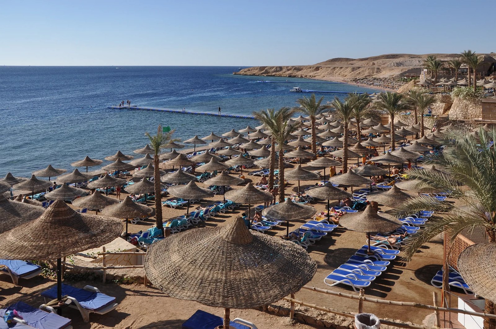 Sun umbrellas and sunbeds on a Sharm El Sheikh beach by the Red Sea