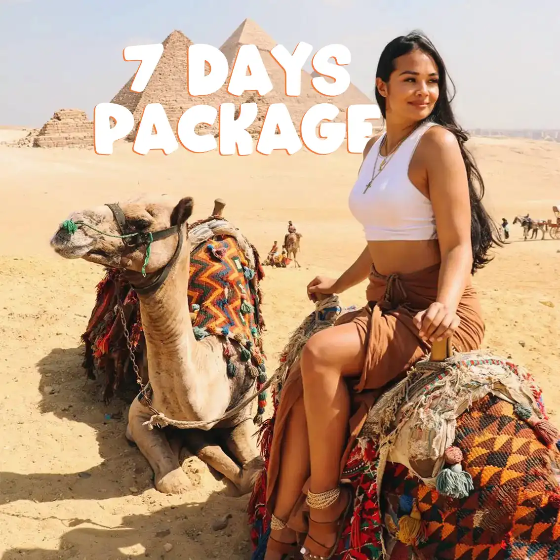 American asian girl on the camel next to the pyramids in Giza with iEgypt tours