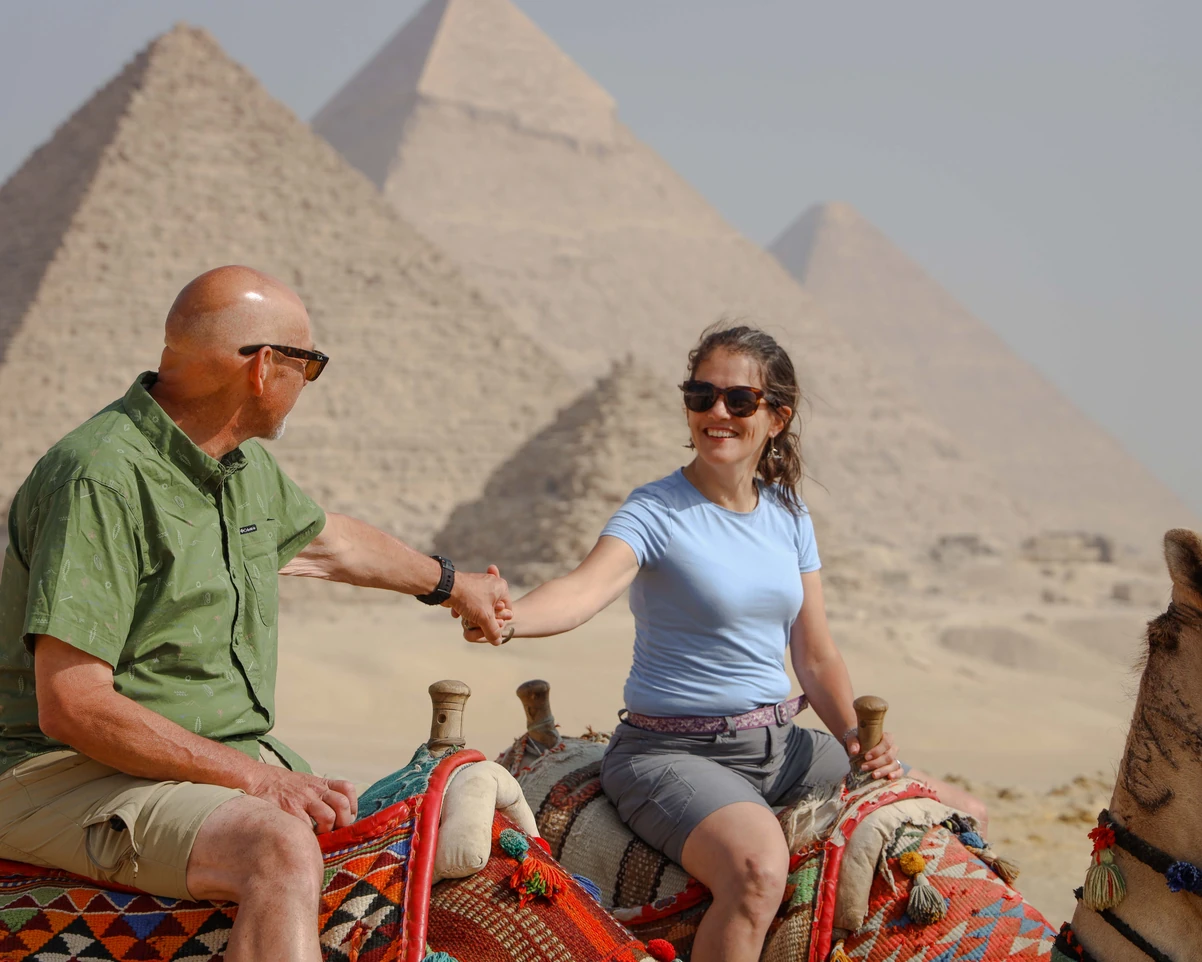 Beatiful blogger visiting the pyramids of Giza with iEgypt tours and travels