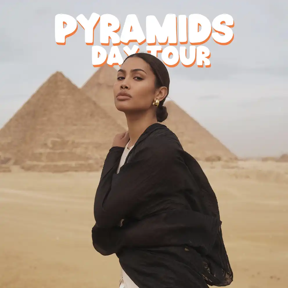 Leyna Bloom beautiful traveler wearing dress in the pyramids in the tour with iEgypt travels